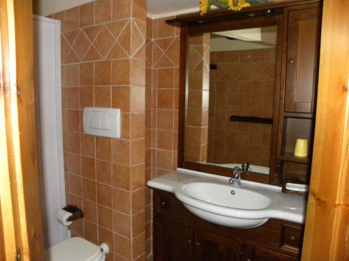 a bathroom with a sink and a toilet at Case Vacanze Albamarina in Lipari