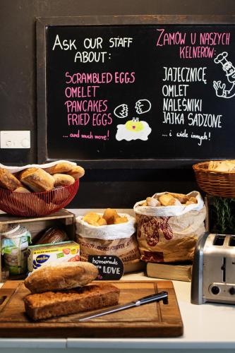 a counter with sandwiches and bread on a chalkboard at METROPOL Hotel Katowice in Katowice