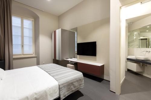A bed or beds in a room at Salina Luxury Suites