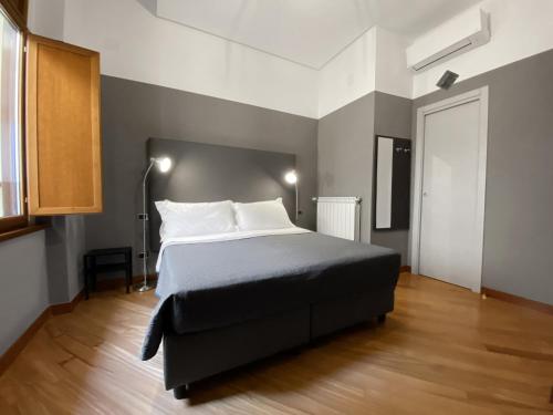 Posteľ alebo postele v izbe v ubytovaní Piazza Carità