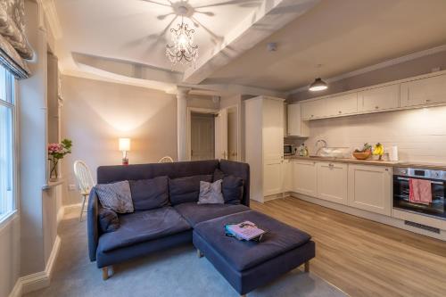 a living room with a couch and a table at Apt 3, 71 Micklegate, YORK in York