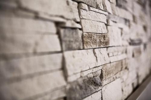 a brick wall is shown with at Ikion Eco Boutique Hotel in Patitiri