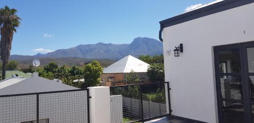 a view of the mountains from the balcony of a house at Hayburg House in Robertson
