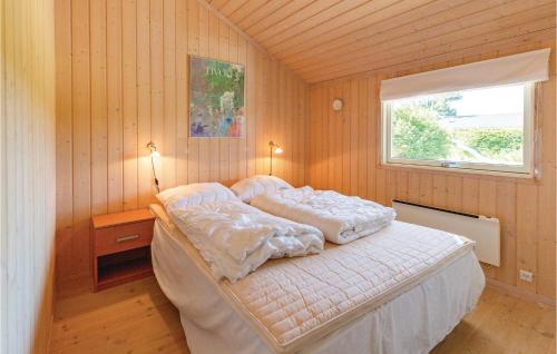 a bedroom with a bed in a room with a window at Amazing Home In Slagelse With Kitchen in Slagelse