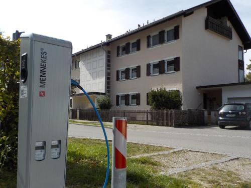 a gas pump in front of a building at Gartenblick in Mittenwald