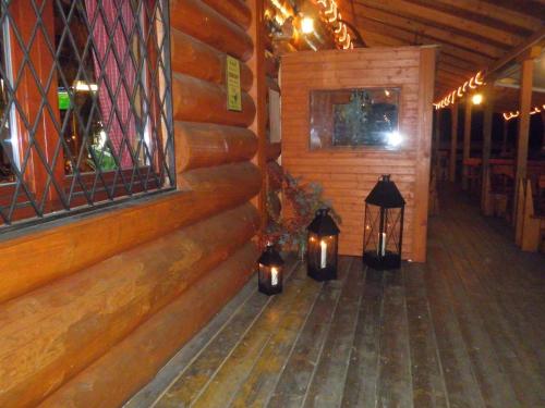 a hallway with lanterns in a wooden building at Sport-hotel Šibeniční vrch in Mnichovice