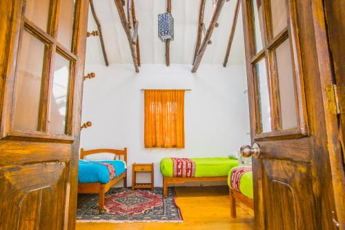 Ein Bett oder Betten in einem Zimmer der Unterkunft Tucan Hostel