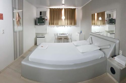 Postel nebo postele na pokoji v ubytování L'acqua Motel Express