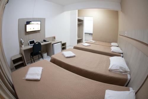 Postel nebo postele na pokoji v ubytování Getúllio Hotel