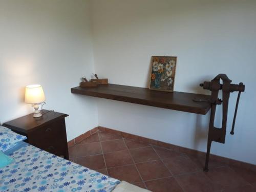 a room with a wooden shelf on the wall at Ca' du Tu in Masone