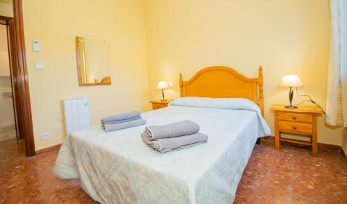 เตียงในห้องที่ La Grana de Carcabuey, house low cost