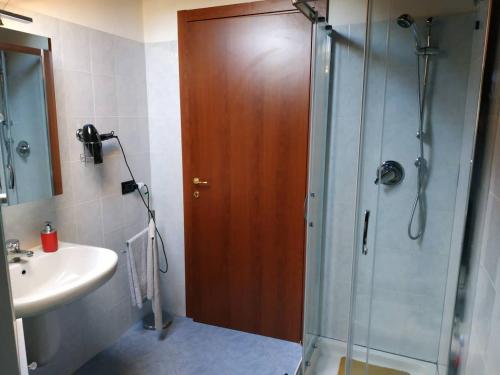 a bathroom with a shower and a sink at Marconi 45 in Osmate Lentate