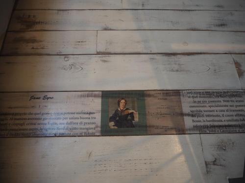 a page of a book with a picture of a woman at B&B Antique Maison in Soave