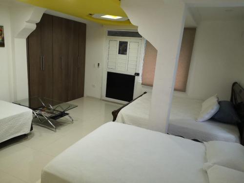 Ένα ή περισσότερα κρεβάτια σε δωμάτιο στο Apartamentos Isla Tropical