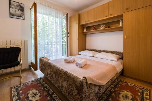 Posteľ alebo postele v izbe v ubytovaní Apartments Dorijan i Karlo