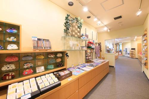 a store with a display case filled with food at Hotel Shikisai in Nikko