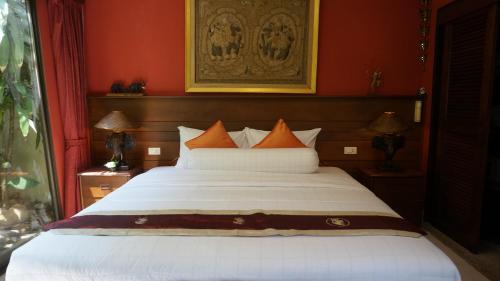 เตียงในห้องที่ LePrive Resort