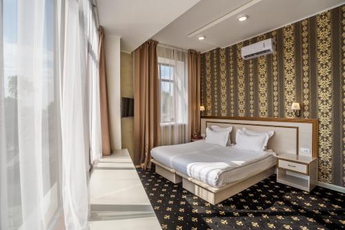 מיטה או מיטות בחדר ב-Hotel Ochagof