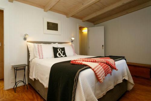 a bedroom with a large bed in a room at Hare's Rest in Taupo