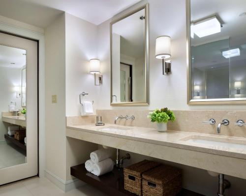 a bathroom with two sinks and a mirror at Hyatt Regency Boston in Boston