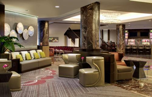 a lobby with couches and chairs in a hotel at Hyatt Regency Boston in Boston