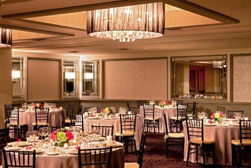 a banquet room with tables and chairs and a chandelier at Hyatt Regency Boston in Boston