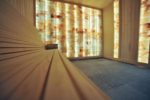 a large window in a room with a couch at Hotel Nais in Niš