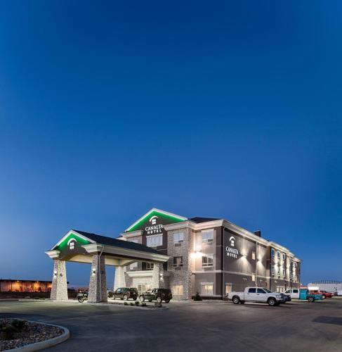 a gas station with a car parked in front of it at Canalta Hotel Esterhazy in Esterhazy