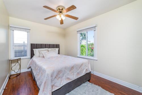 a bedroom with a bed and a ceiling fan at Your Home in LA in Los Angeles