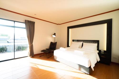 Posteľ alebo postele v izbe v ubytovaní Baan Anong Hotel