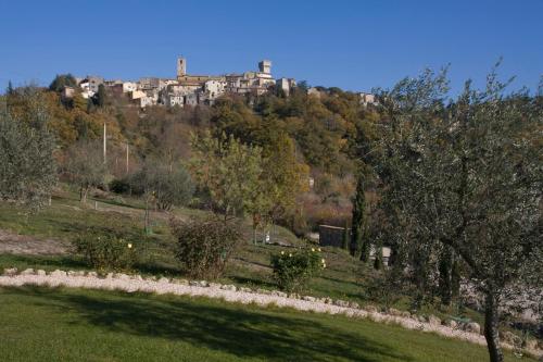 a large building on top of a hill at Aurora Agriturismo in San Casciano dei Bagni