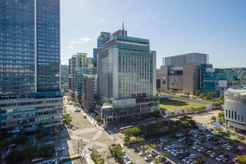 an aerial view of a city with tall buildings at Haeundae Centum Hotel in Busan
