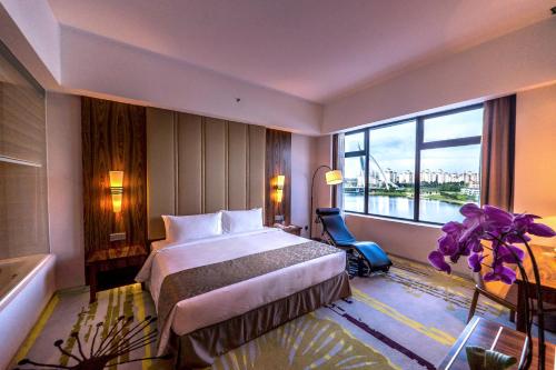 Postel nebo postele na pokoji v ubytování Zenith Hotel Putrajaya