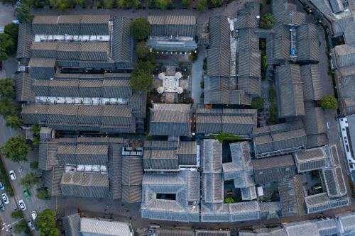 an overhead view of a building with many roofs at Doof Resort Hotel in Lijiang