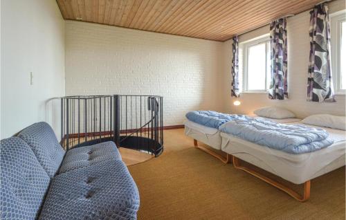 a room with two beds and a couch in it at Lovely Home In Fur With Kitchen in Fur