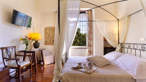 Postel nebo postele na pokoji v ubytování Abbazia Collemedio Resort & Spa