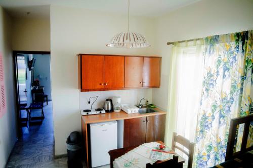 A kitchen or kitchenette at Yiannis Apartments