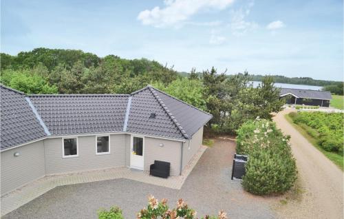 an aerial view of a house with a driveway at Pet Friendly Home In Ansager With Sauna in Ansager