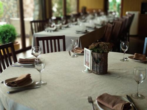 a long table with glasses and napkins on it at Kolobok in Luts'k