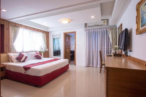 Ένα ή περισσότερα κρεβάτια σε δωμάτιο στο Gusto Pratunam Hotel