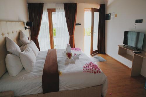 Ένα ή περισσότερα κρεβάτια σε δωμάτιο στο Club Kaafu Maldives