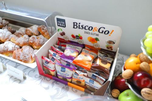 a refrigerator filled with lots of different types of food at Albergo Cantiani in Ancona