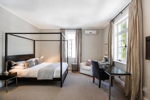 A bed or beds in a room at River Manor Boutique Hotel by The Living Journey Collection