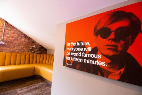 a painting on the wall of a room with a couch at York Street Studios in Liverpool
