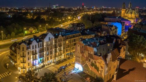 an aerial view of a building at night at Śródka Boutique Hotel in Poznań