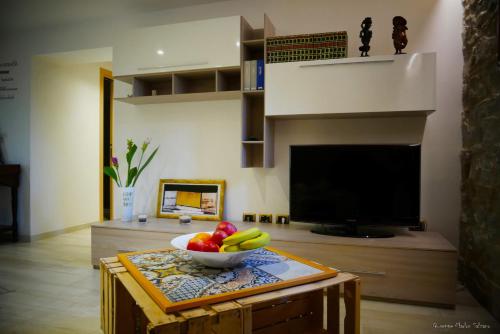 a bowl of fruit on a table in a living room at B&B AL TEATRO ROMANO in Benevento
