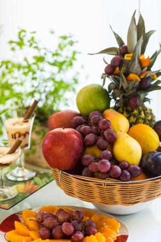 a basket of fruit sitting on top of a table at Eltina Hotel in Rethymno Town