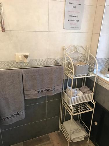 a bathroom with a towel rack and a sink at Casa Marida in Camigliatello Silano