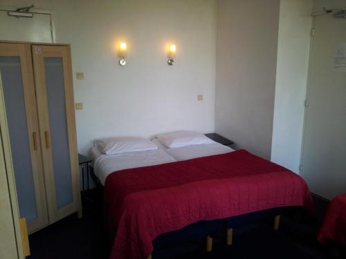 Postel nebo postele na pokoji v ubytování Hotel Baan