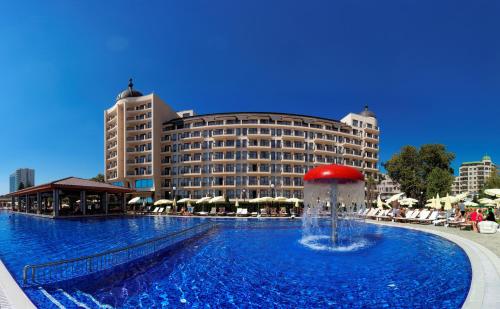 a large pool with a fountain in front of a hotel at Admiral Hotel - Ultra All Inclusive & Private Beach in Golden Sands